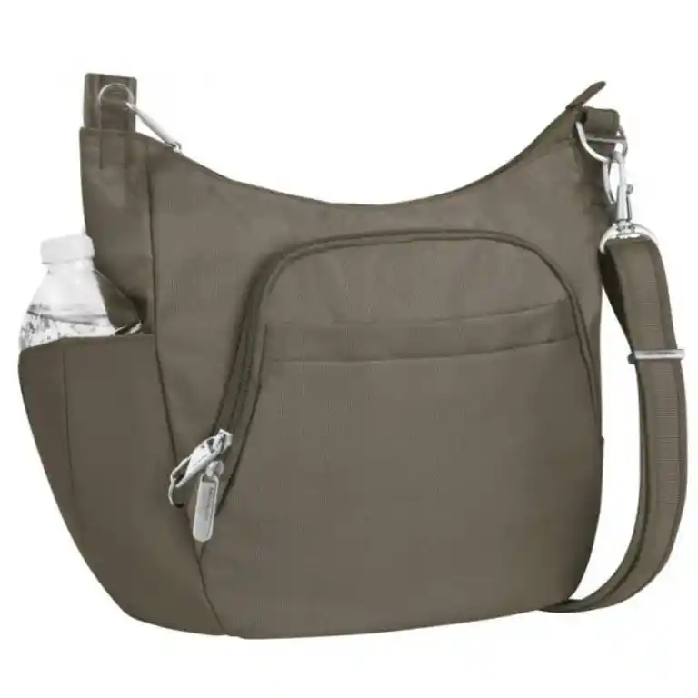 Taupe crossbody travel bag with an adjustable shoulder strap, a large curved zippered front compartment, and an open side pocket holding a water bottle.